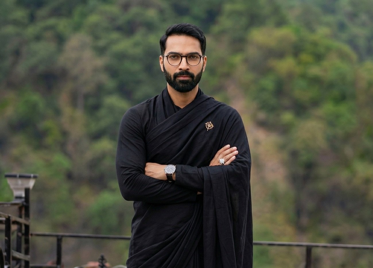 Acharya Anand — Vedic Astrologer, mountain background authority portrait